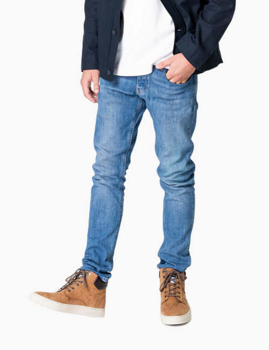 Man in navy jacket and jeans streetwear